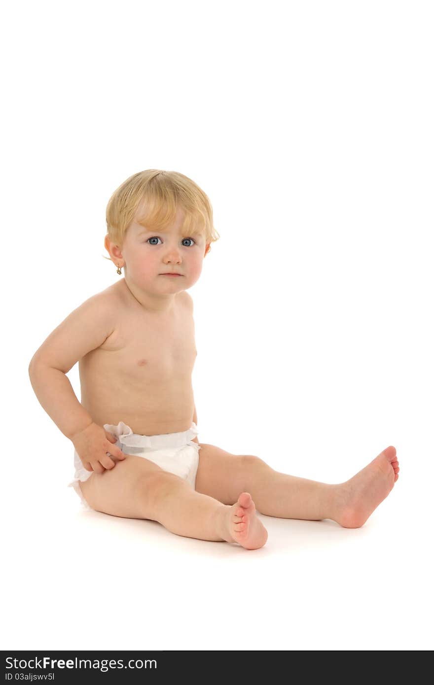 Baby sits, on white background.