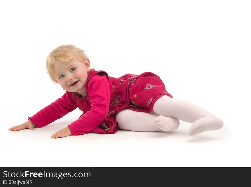 Smiling child lies, on white background.