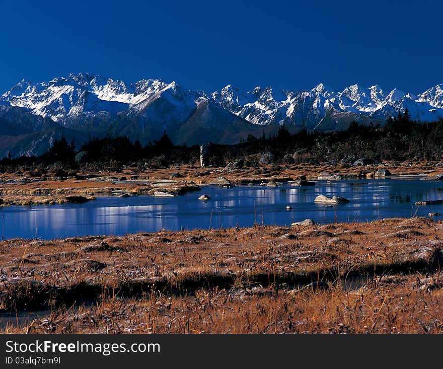 Snow mountain by the river