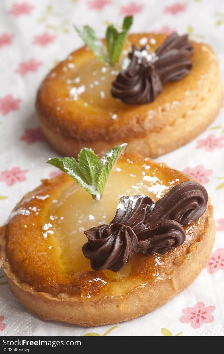 Delicious mini chocolate and pear tarts with mint