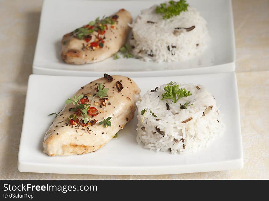 Grilled chicken breast with basmati rice on a plate. Grilled chicken breast with basmati rice on a plate