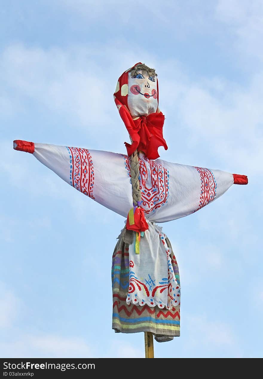 Carnival doll against the sky