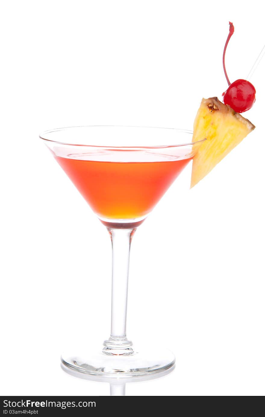 Red Cosmopolitan martinis cocktail with vodka, rum, liqueur, lemon juice, pineapple, maraschino cherry in martini glass isolated on a white background. Red Cosmopolitan martinis cocktail with vodka, rum, liqueur, lemon juice, pineapple, maraschino cherry in martini glass isolated on a white background