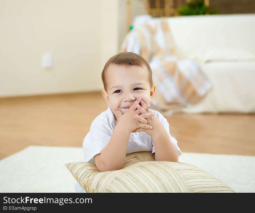 Happy smiling and laughing boy at home