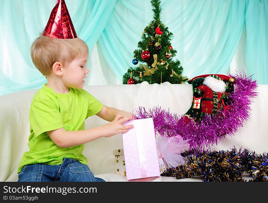 Little boy getting ready for the holiday. Happy New Year and Merry Christmas!