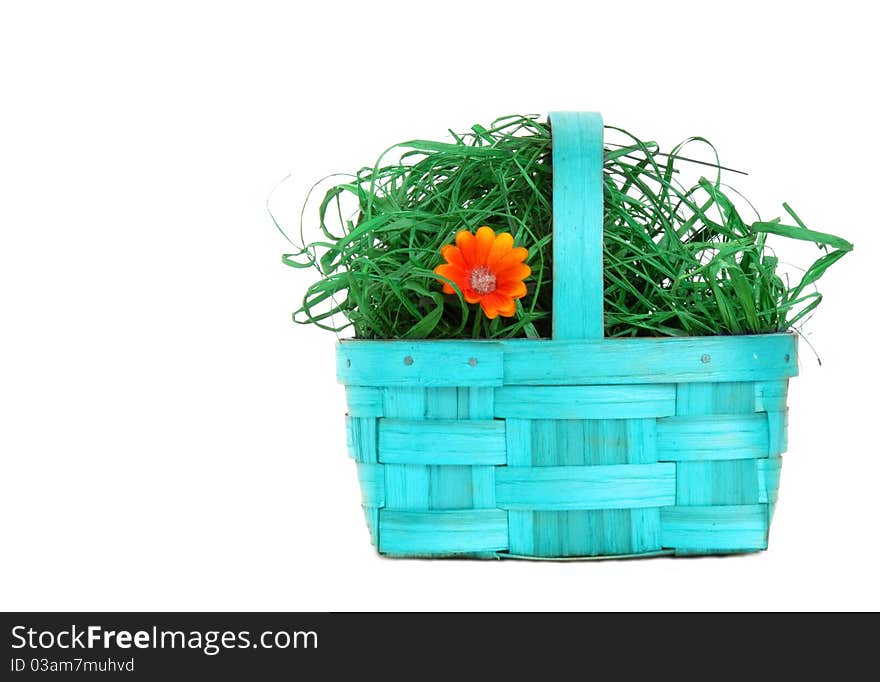 Blue wicker basket with flowers isolated on white background. Blue wicker basket with flowers isolated on white background