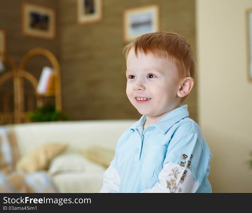 A happy smiling boy playing and having fun at home. A happy smiling boy playing and having fun at home