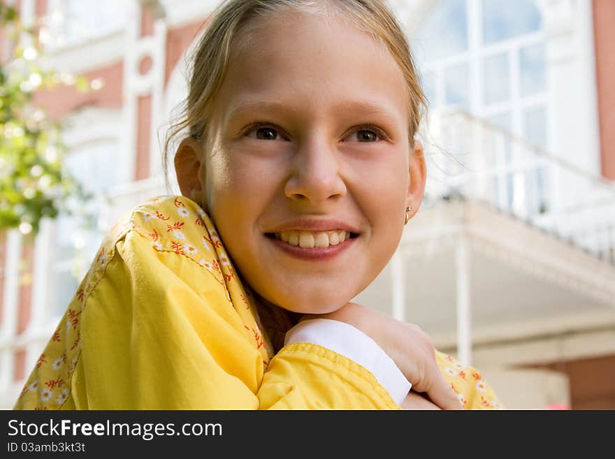 The happy little girl goes to school. The happy little girl goes to school