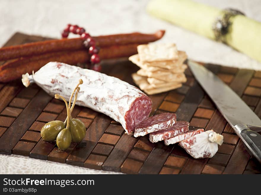 Nice italian slami, arranged with slices on a board. Nice italian slami, arranged with slices on a board