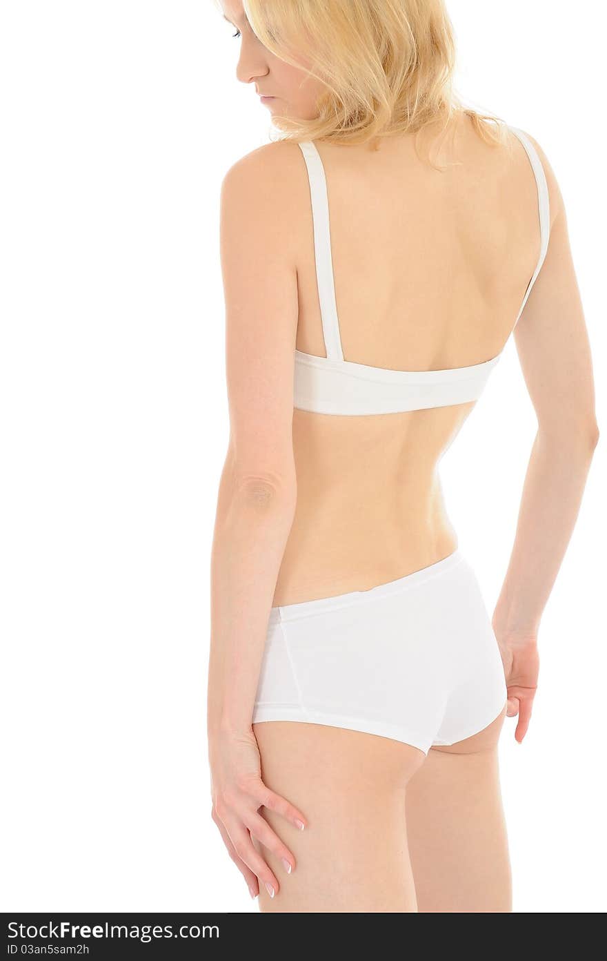 Part of beautiful fit slim woman body in white underwear from the back. isolated