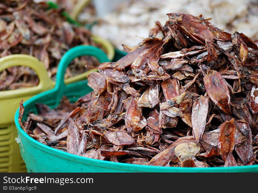 Dry squid in green basket at thailand