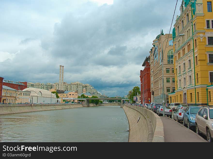 Moscow river embankment houses tubes clouds