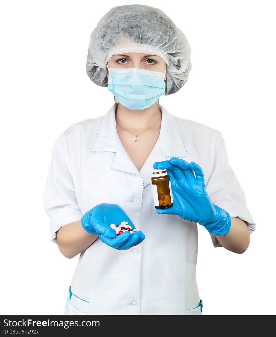 Nurse with pills on white background