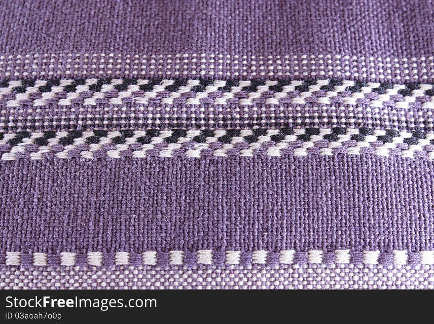 Loose weave fabric on a throw pillow. Loose weave fabric on a throw pillow