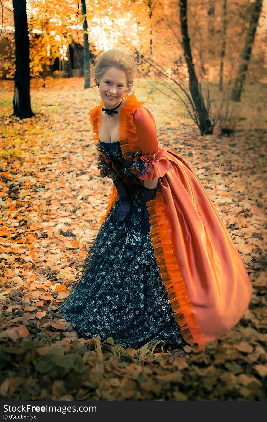 Baroque girl in autumn park. Baroque girl in autumn park