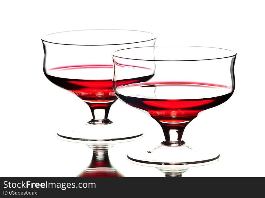 Two wine glasses with wine. White background. Studio shot.