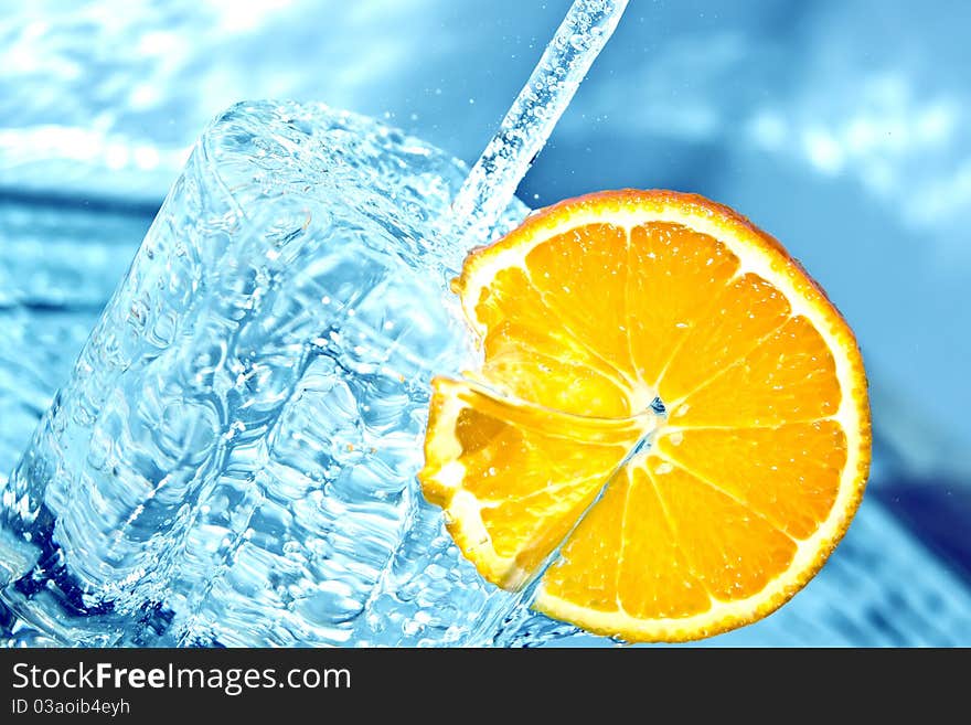 Fresh orange in water splash