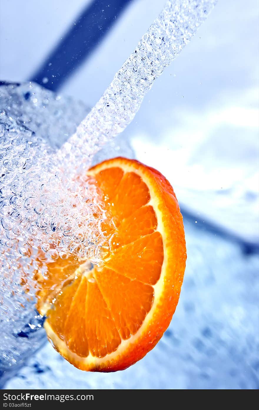 Fresh orange in water splash