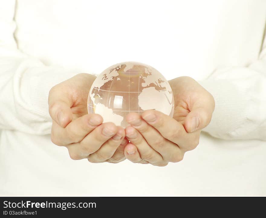 Globe on the human hand on white. Globe on the human hand on white