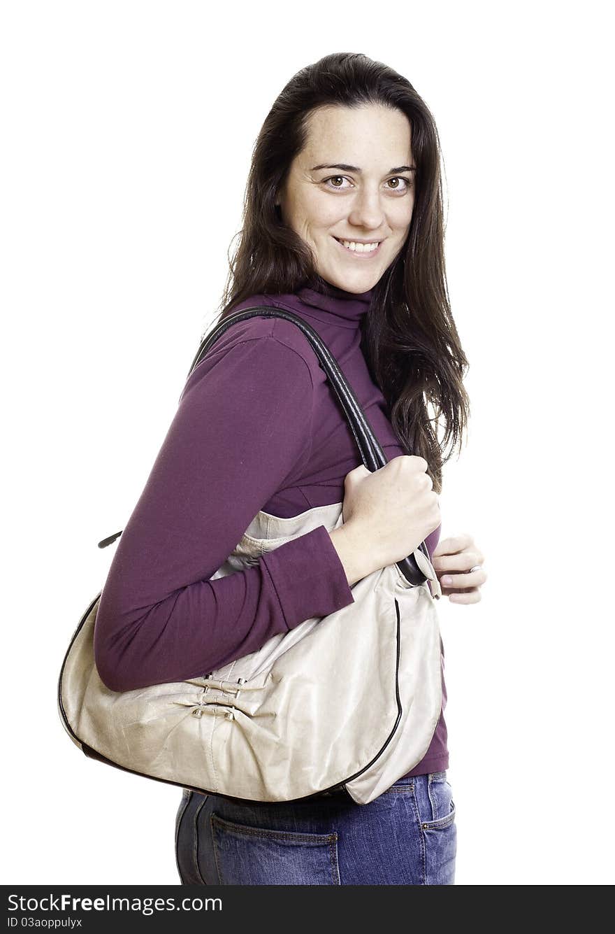 Young woman with leather bag on white background