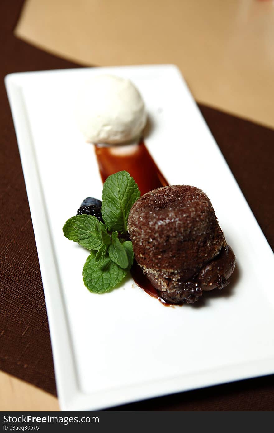 Chocolate Dessert on a square dish with fresh mint and ice cream