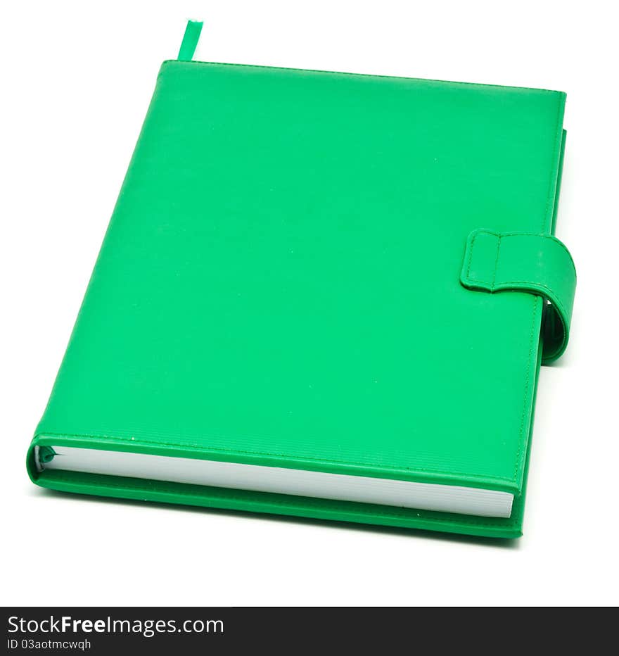 Green book on white background