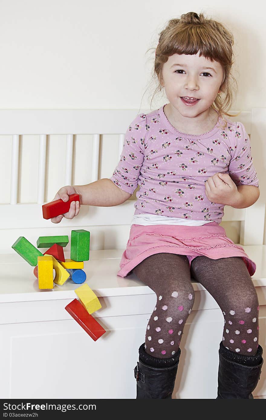 Girl And Wooden Blocks