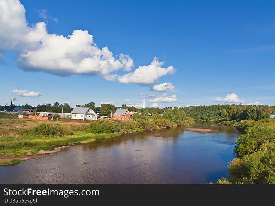 Summer landscape with river and blue sky