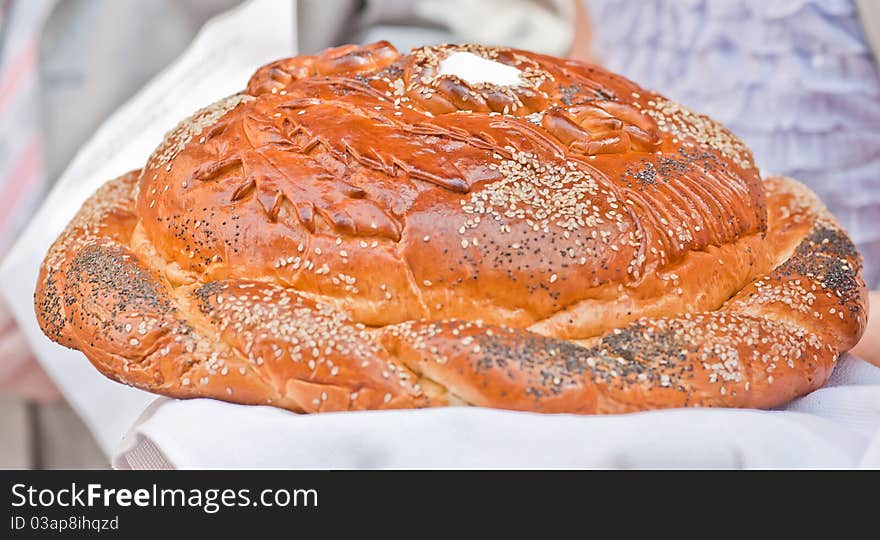 Traditional Ukrainian wedding bread on an embroidery towel