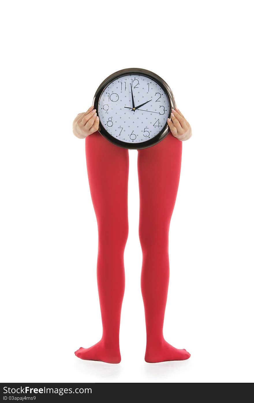 Legs in red tights and clock