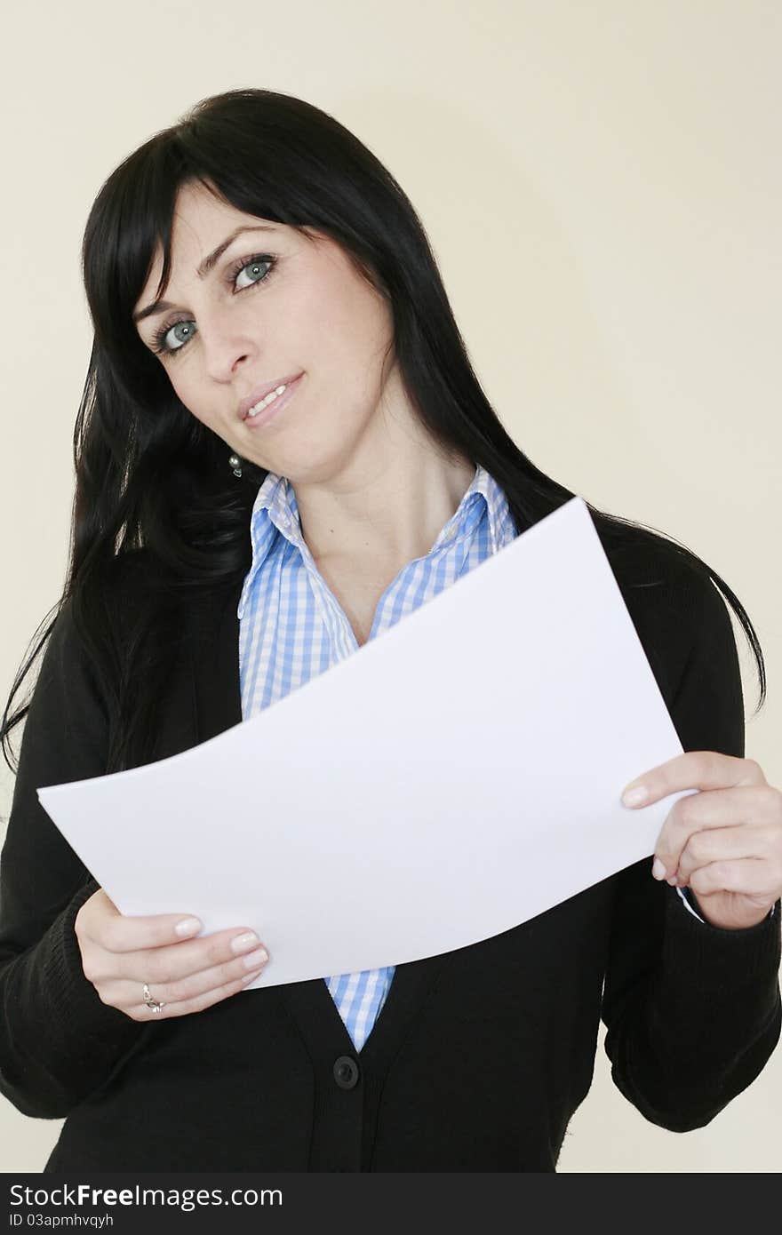 Business woman with blue eyes having a paper in her hands smiling looking at the camera. Business woman with blue eyes having a paper in her hands smiling looking at the camera