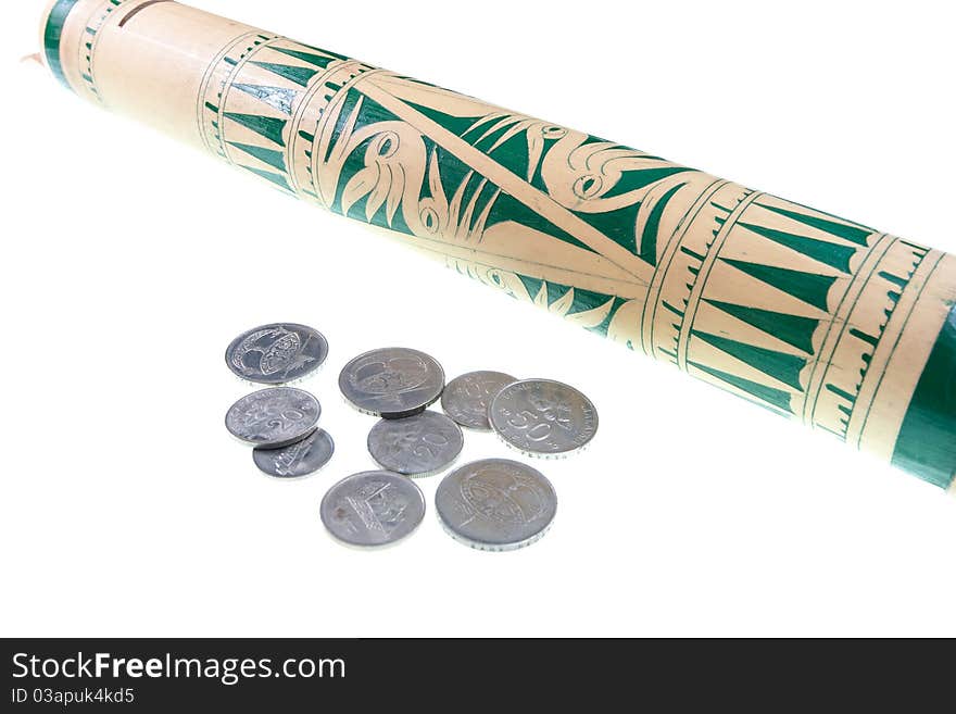 Coin and traditional bamboo tubes