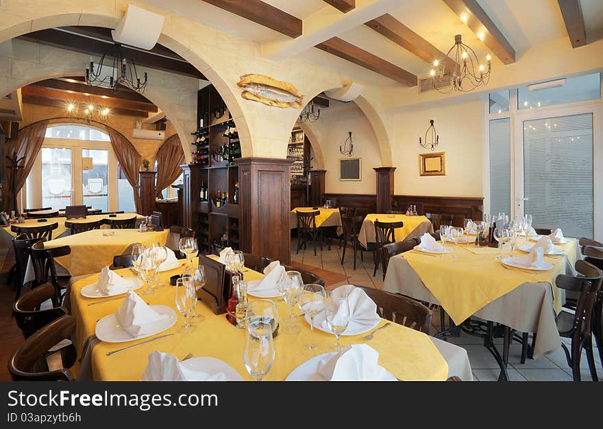 Tables, chairs and lighting equipment of a restaurant. Tables, chairs and lighting equipment of a restaurant.