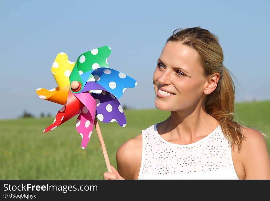 Young woman with wind engine