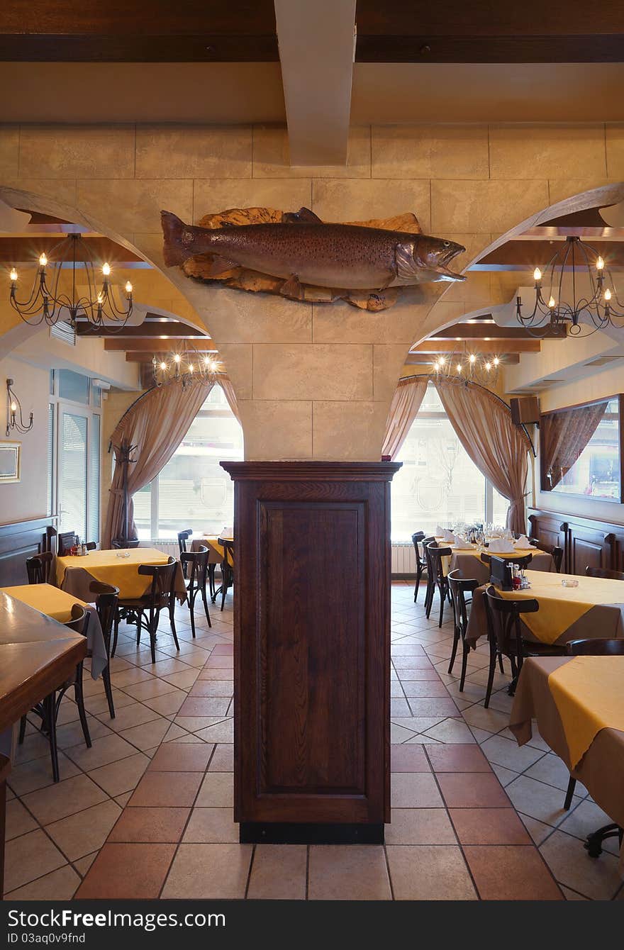 Tables, chairs and lighting equipment of a restaurant. Tables, chairs and lighting equipment of a restaurant.