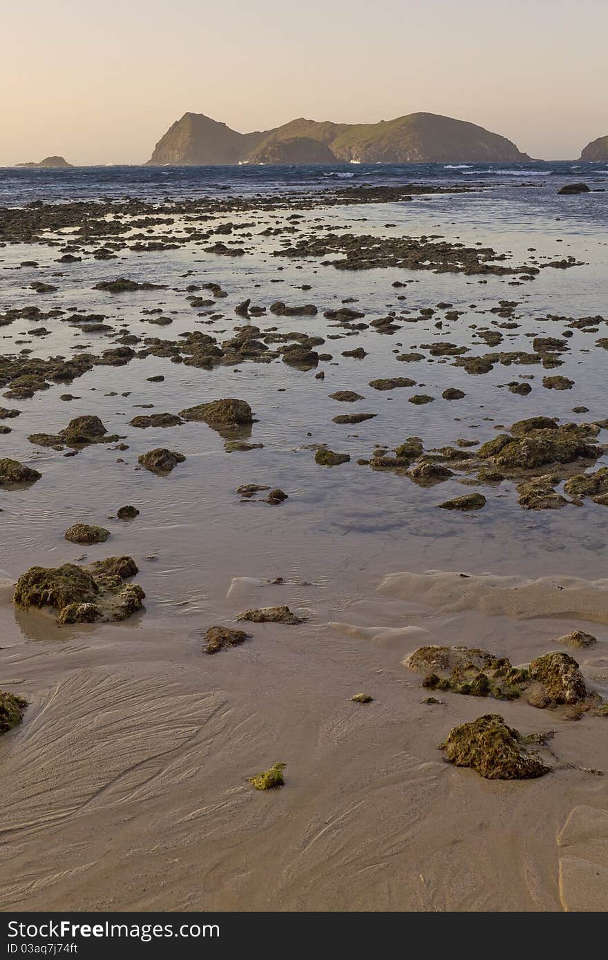 Exposed rock pools on the east cost of Lord Howe Is. Sunset over beach at low tide. Exposed rock pools on the east cost of Lord Howe Is. Sunset over beach at low tide