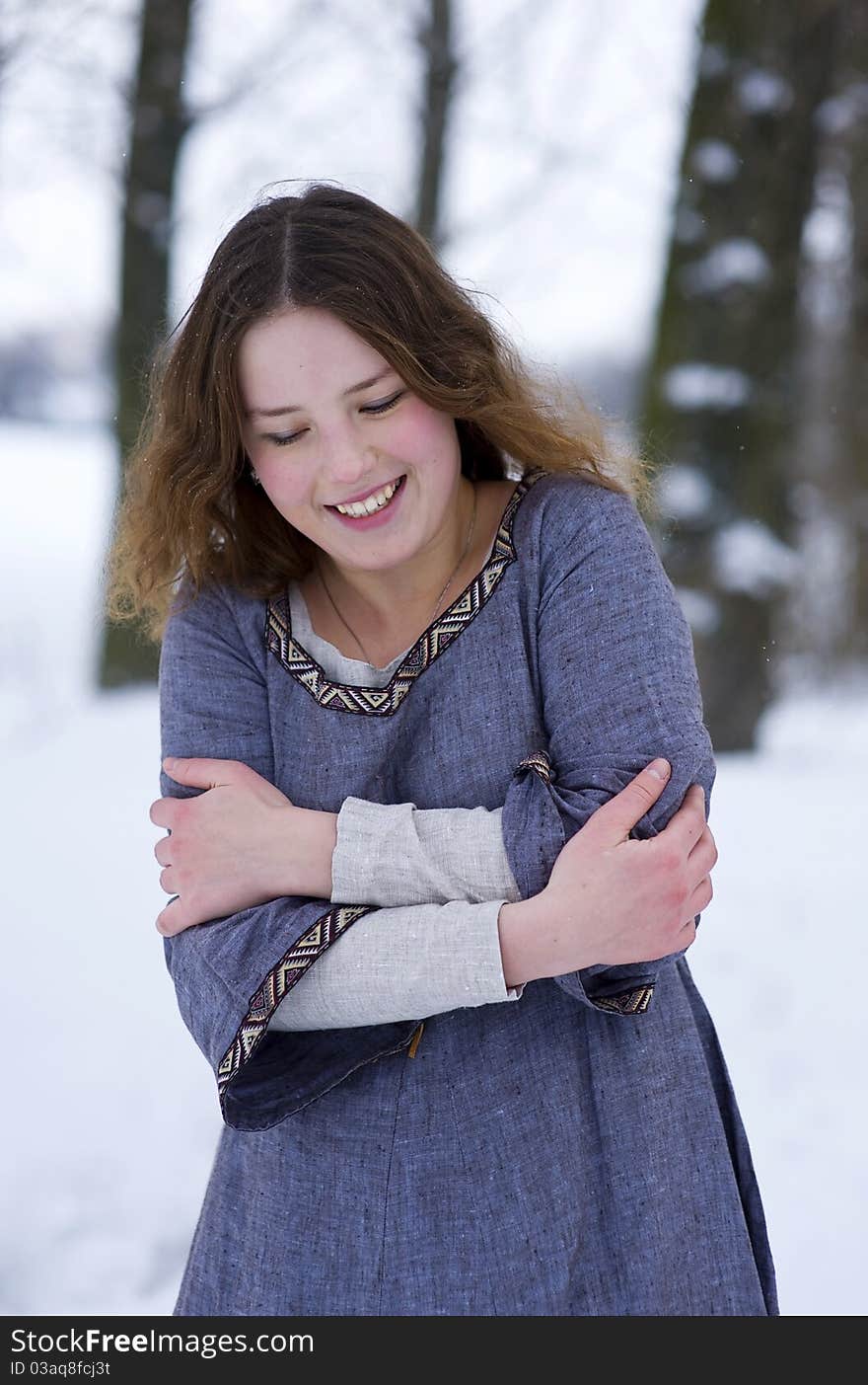 Frozen girl in medieval dress in winter. Frozen girl in medieval dress in winter