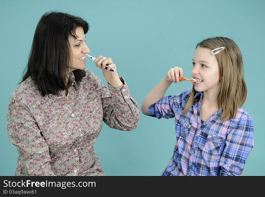 White child studying brushing tooth and mother teaching. White child studying brushing tooth and mother teaching