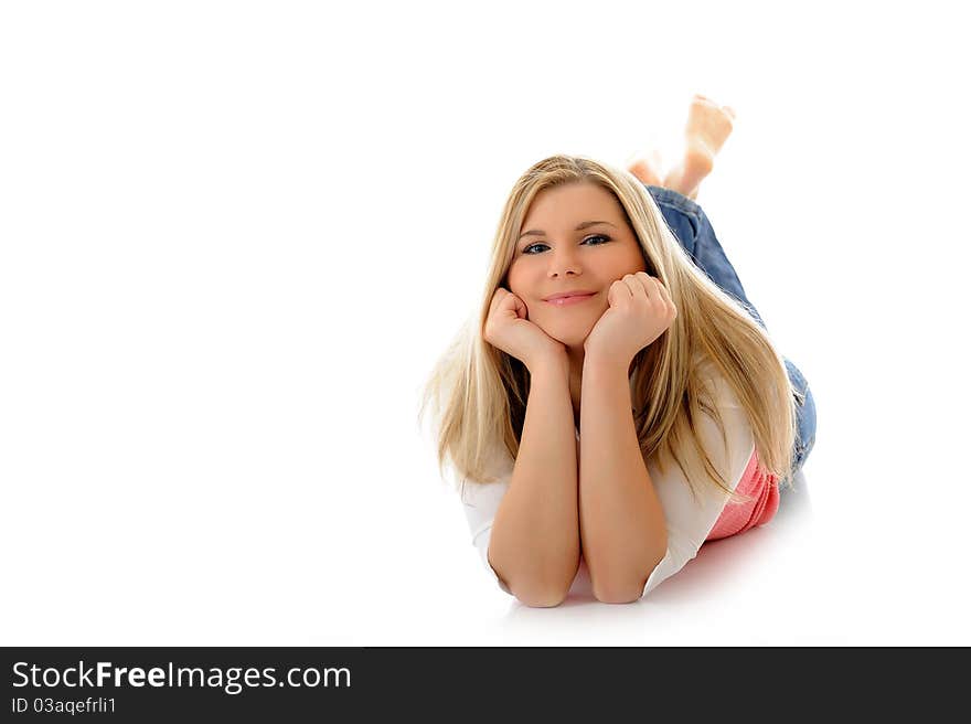 Young casual smiling woman lying on the floor relaxing isolated on white background. Young casual smiling woman lying on the floor relaxing isolated on white background