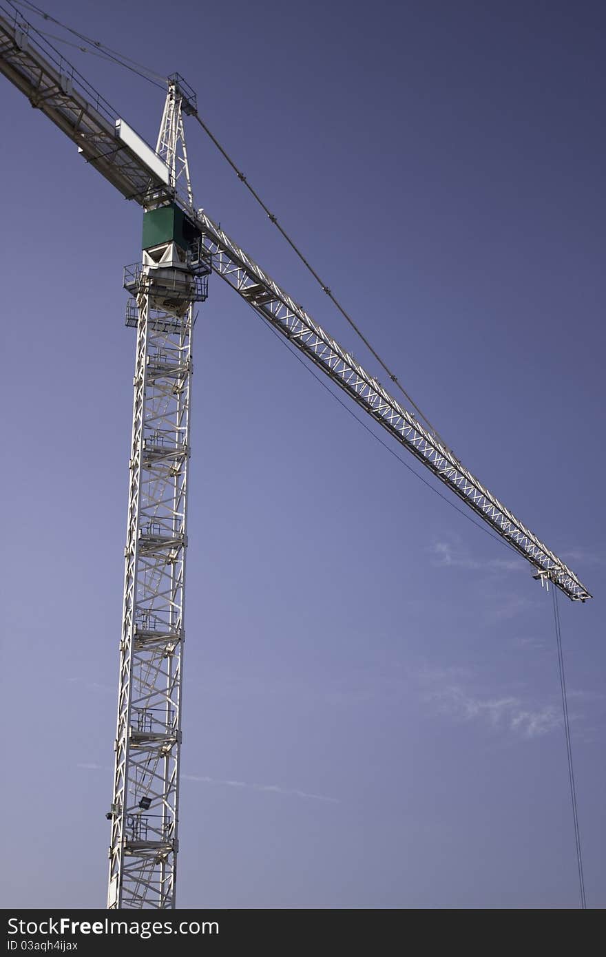 Construction cranes against the blue sky. Construction cranes against the blue sky