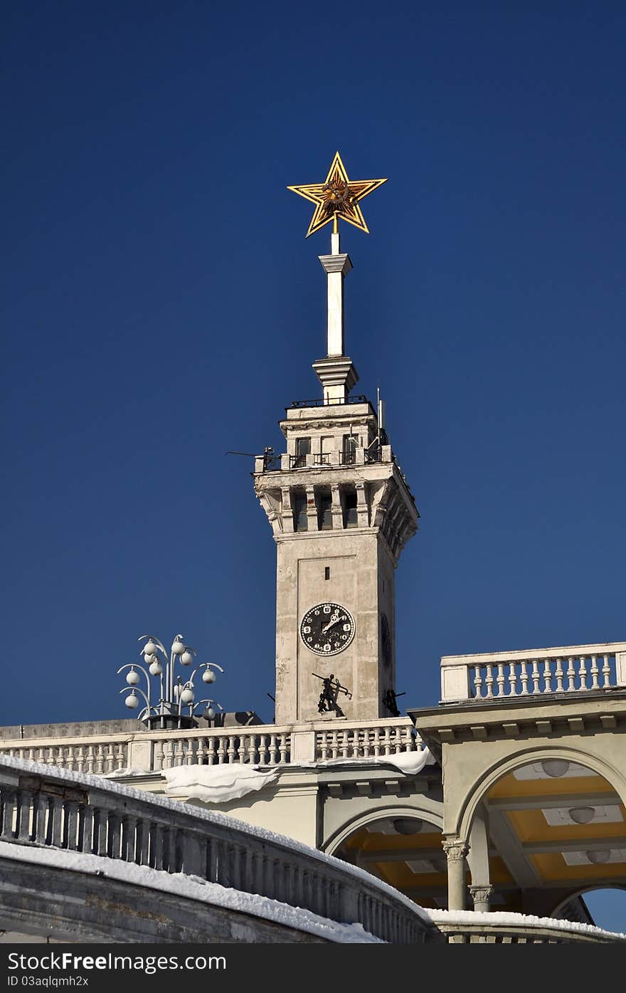 Northern passenger river port of moscow, russia. stalin period architecture. soviet five star symbol with sickle and hammer on telescopic extendable mast