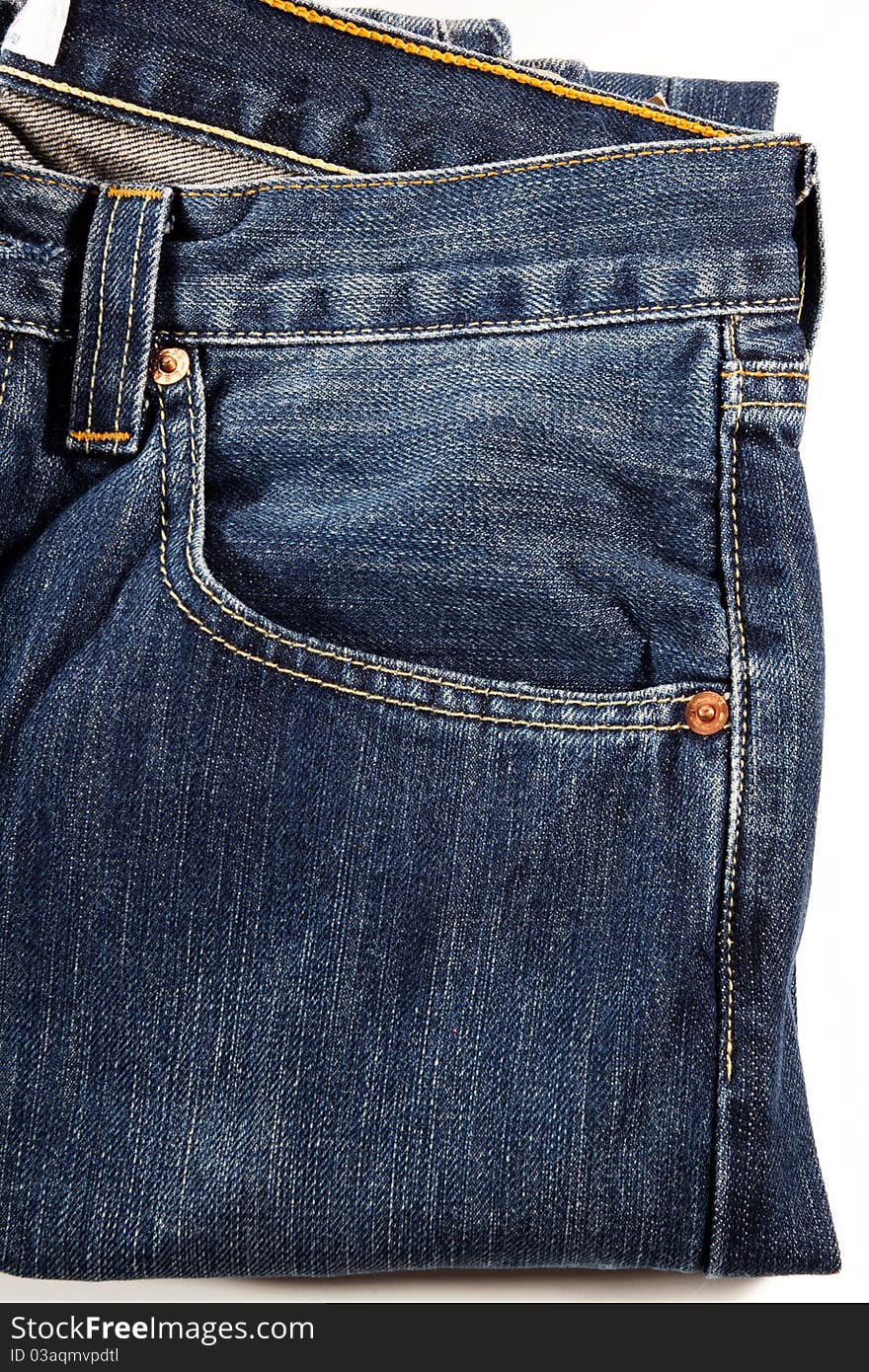 A detail of a blue jeans