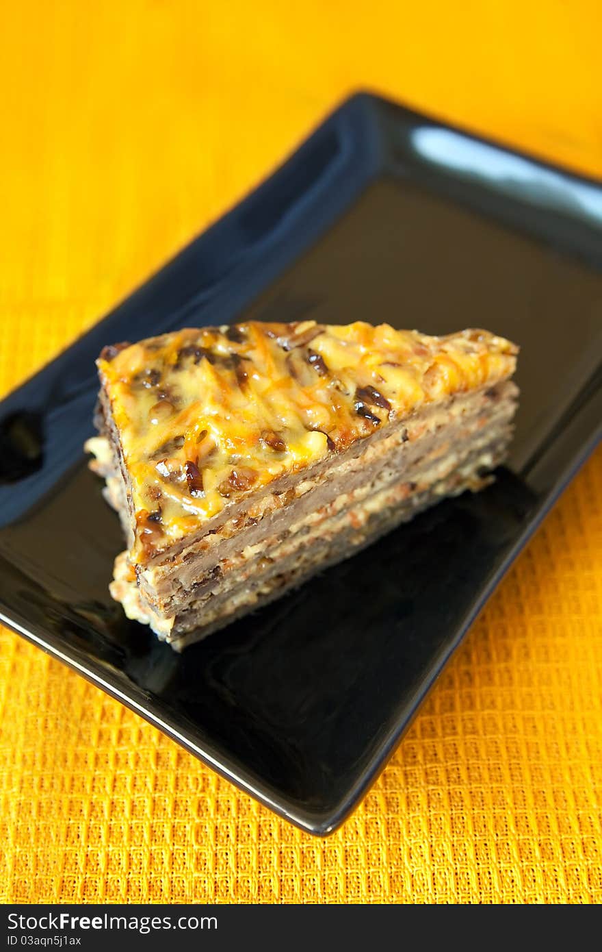 Close-up portion of liver cake with fried carrot and onion