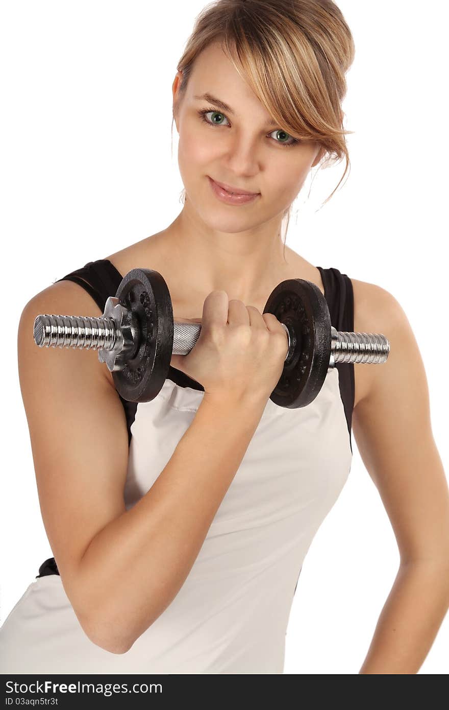 Young woman is lifting a bar-bell. Young woman is lifting a bar-bell