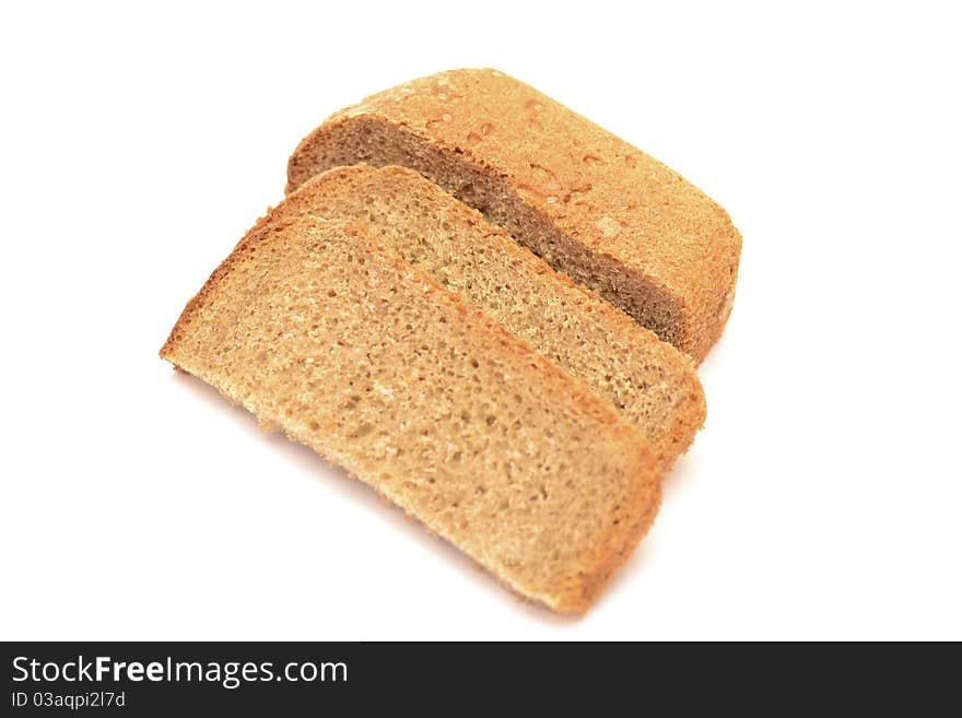 Photo of slices of black bread on a white background. Photo of slices of black bread on a white background.