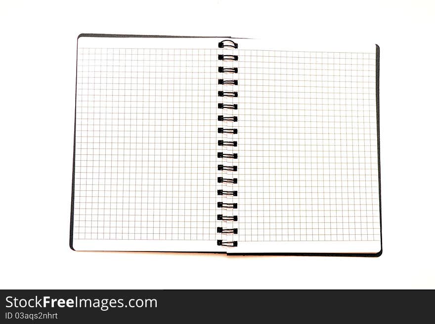 Photo of the uncovered notepad on a white background. Photo of the uncovered notepad on a white background.