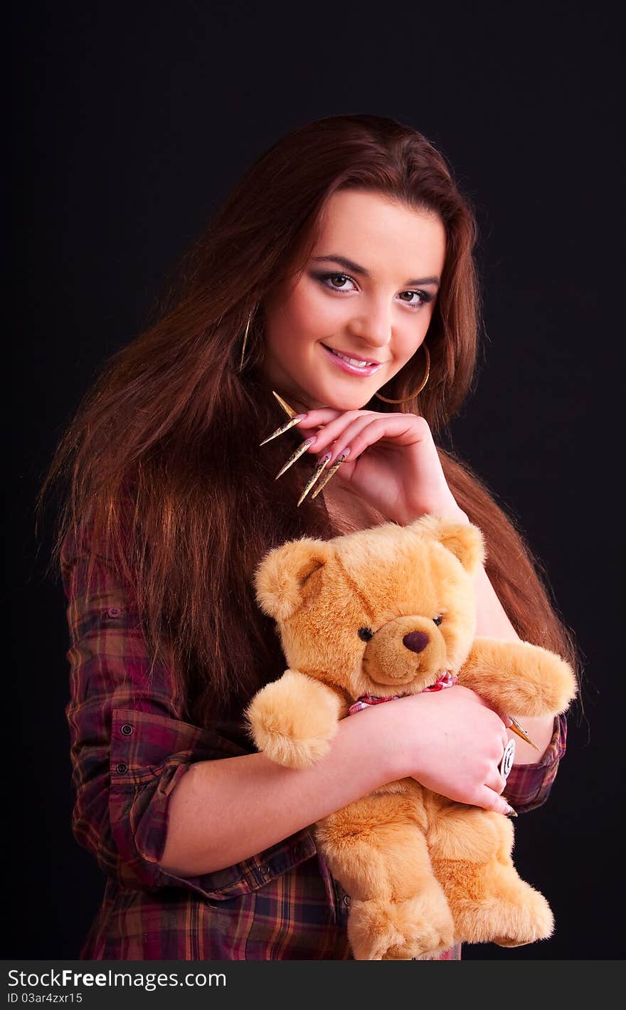 Beautiful longhair girl is holding the teddy bear. Beautiful longhair girl is holding the teddy bear