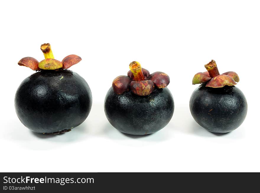 Three Mangosteens on white background.