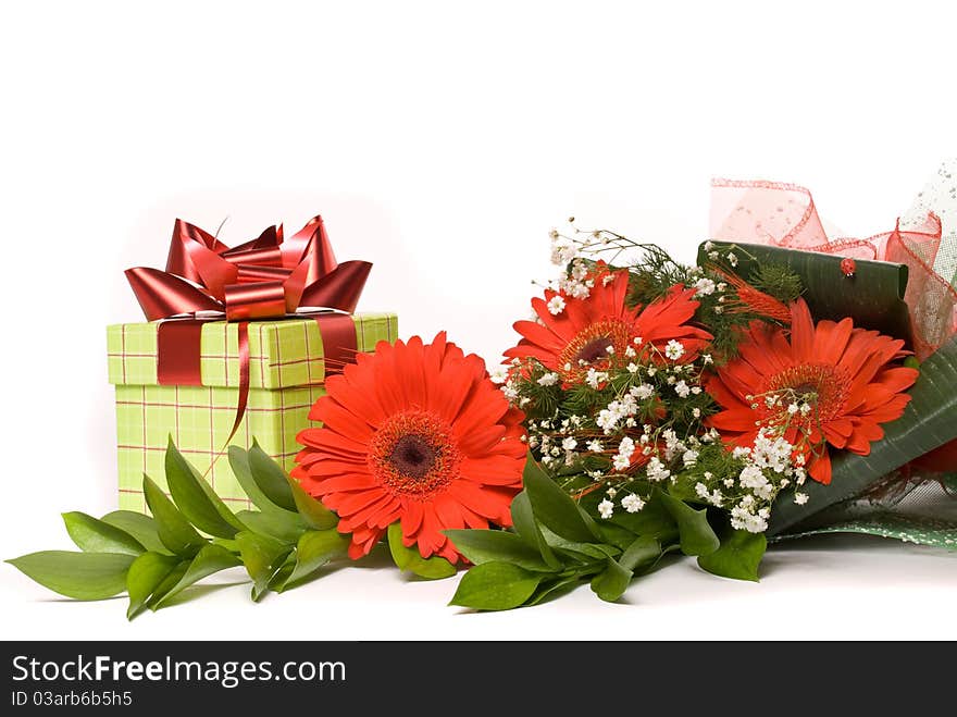 Magnificent bouquet gerbera and present box on a white