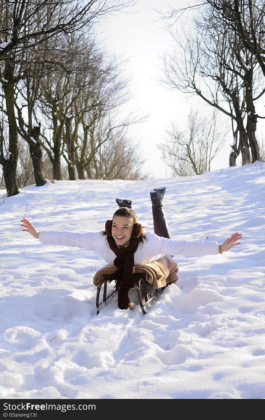 Teen having fun on sledge